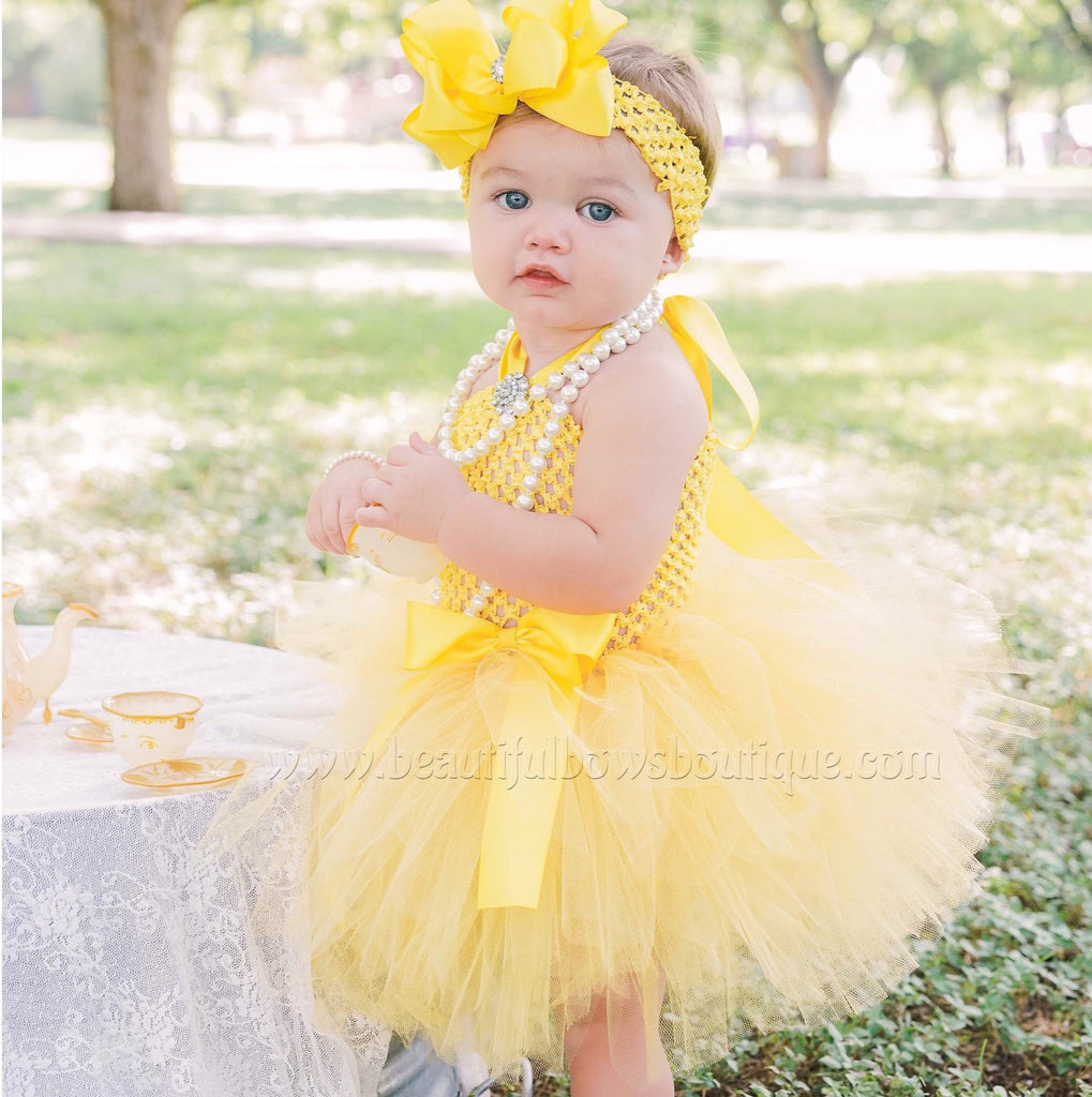 cute baby girl in yellow dress